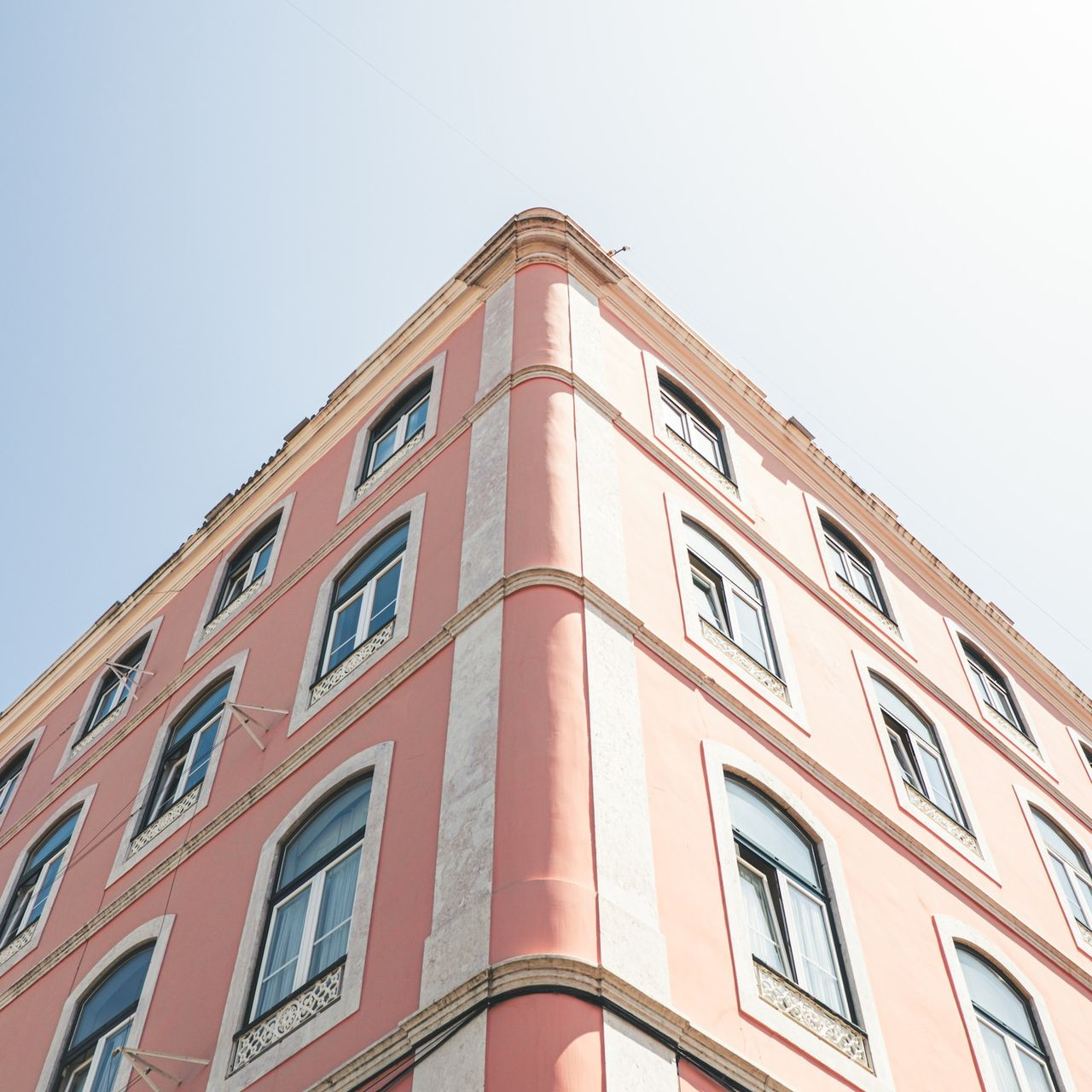 low angle photo of pink building